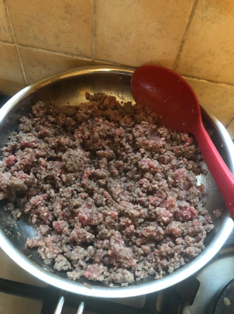 Frying the chopped meat in a pan