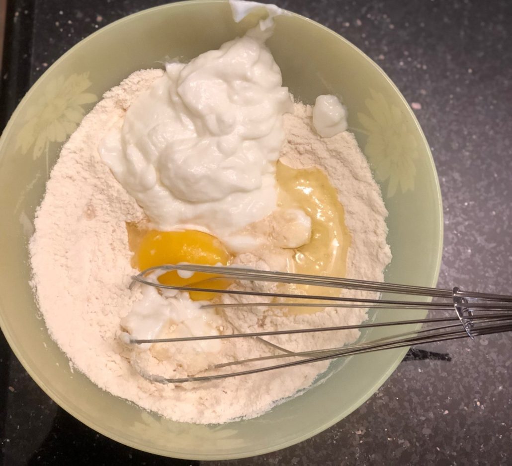 Whisking pancake ingredients in bowl