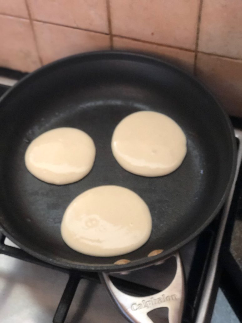 unoiled frying pan with pancakes