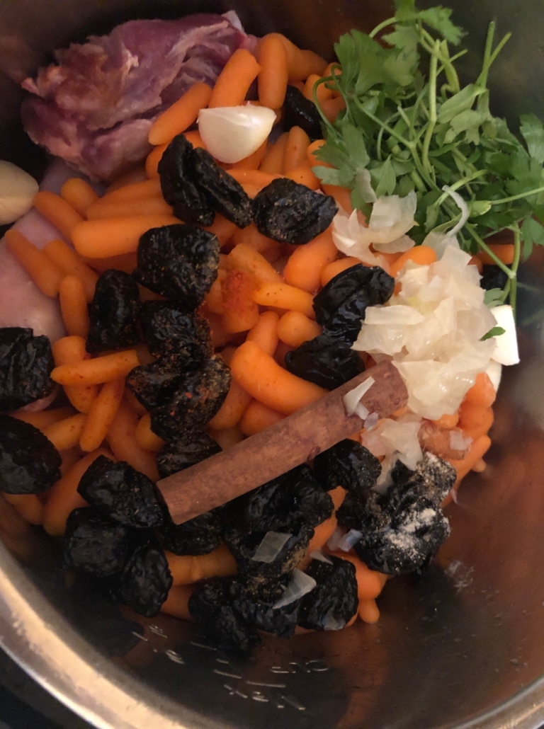 Lamb, garlic, cinnamon, parsley, carrots prunes and saffron
