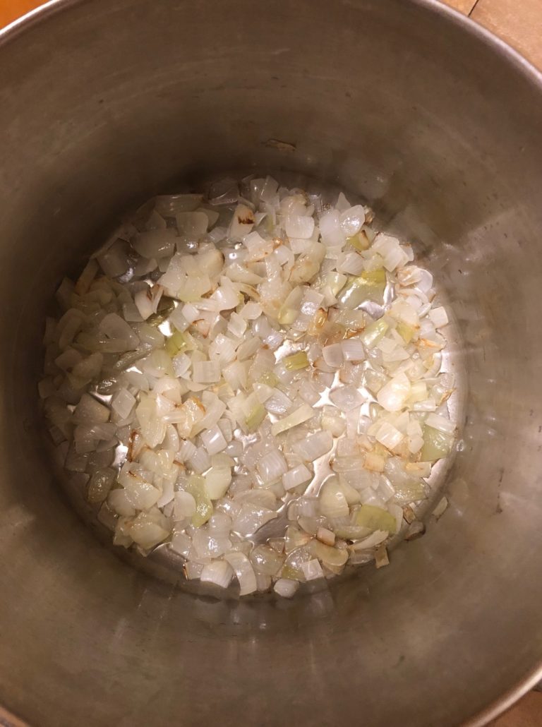 Chopped onions in oil in a soup pot