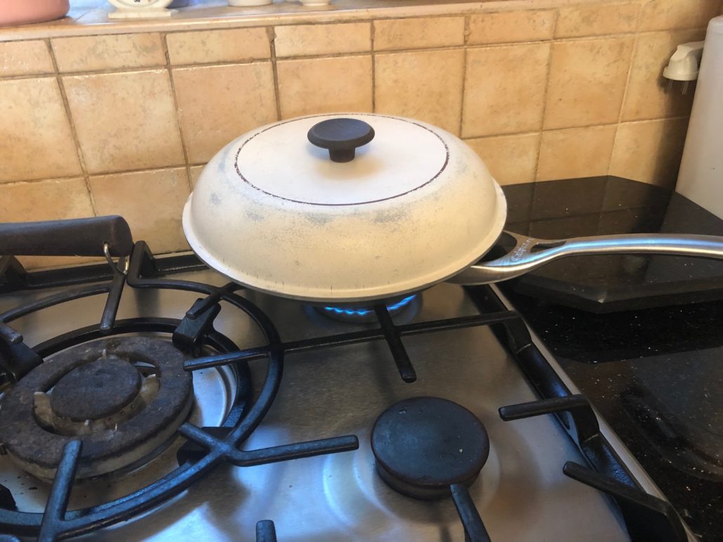 covering the tilapia to cook