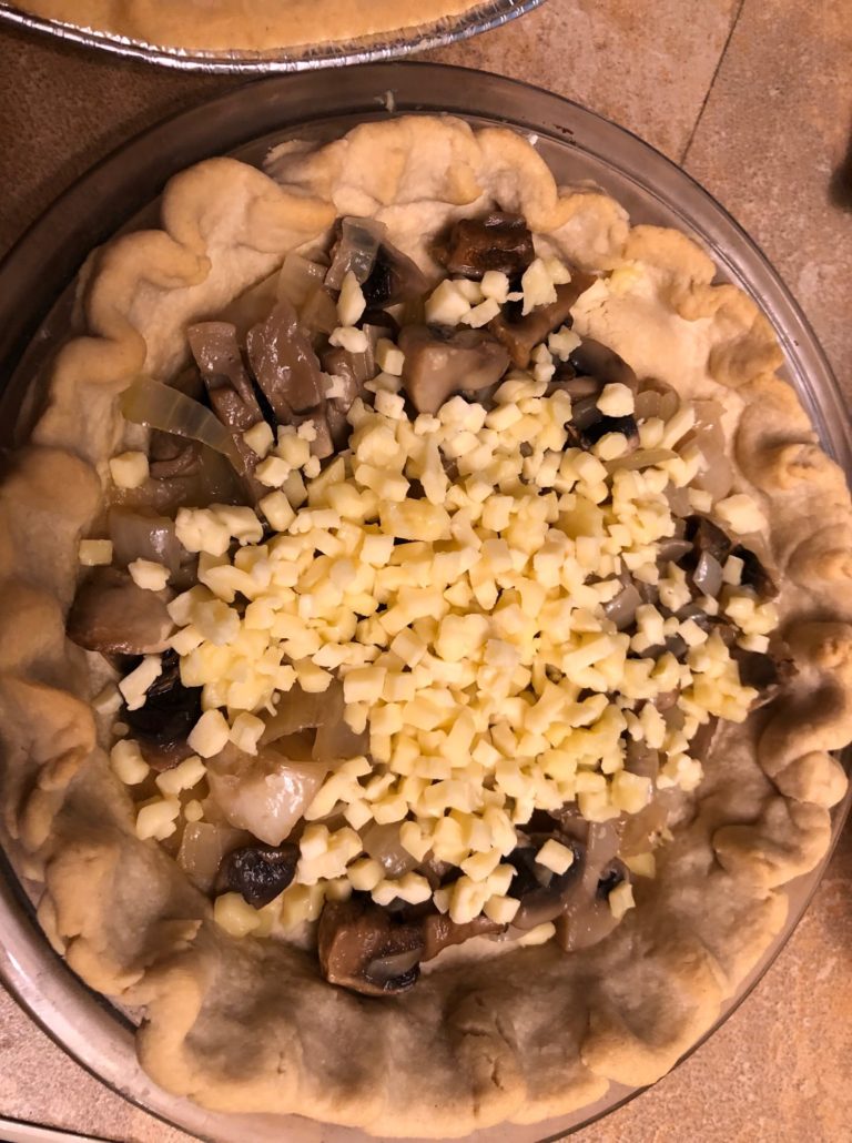 Prebaked crust with filling and cheese