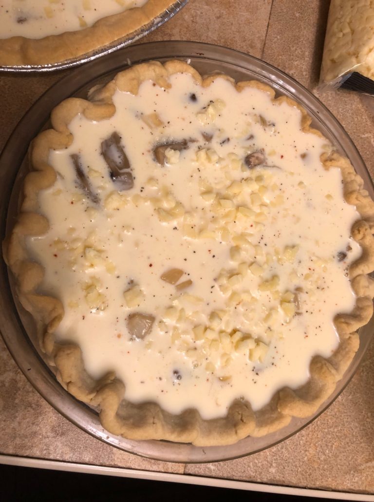 Liquid filling poured over solid filling for quiche