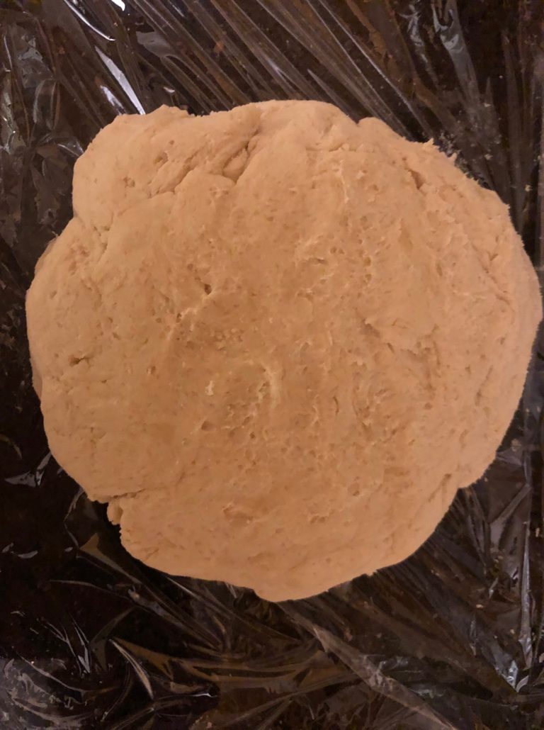 Oiled circle of rugelach dough