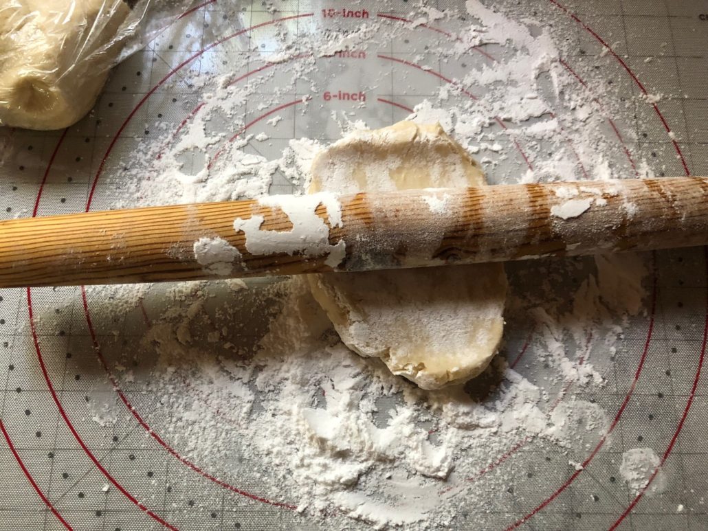 Rolling out the rugelach dough on powdered sugar