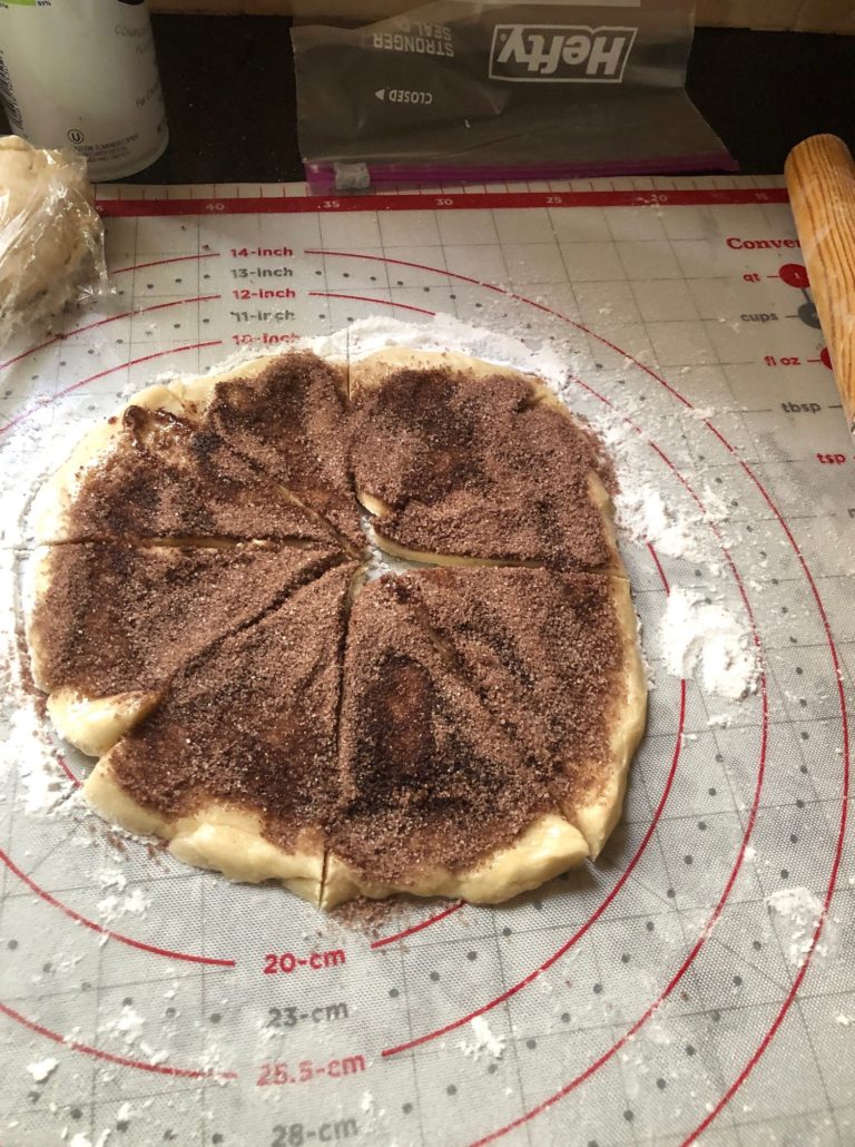 Cocoa sugar mix sprinkled on rugelach dough