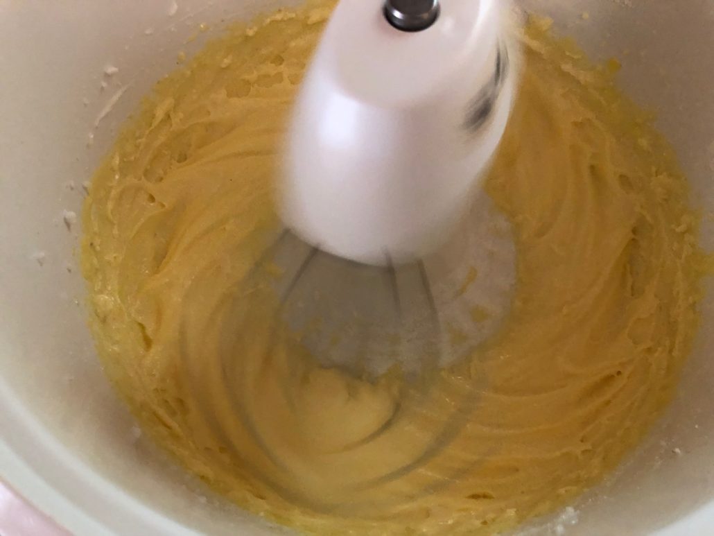 Whipped yolks and sugar pale yellow in color