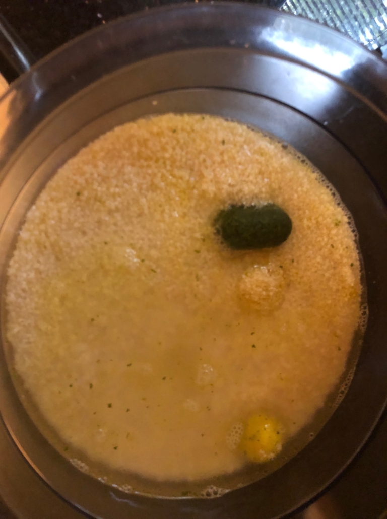 chopped parsley, soup powder and olive  oil on couscous