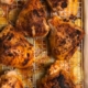 Paprika thyme honey drizzled chicken thighs with potatoes in drippings