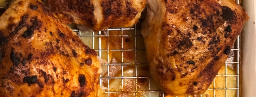 Paprika thyme honey drizzled chicken thighs with potatoes in drippings