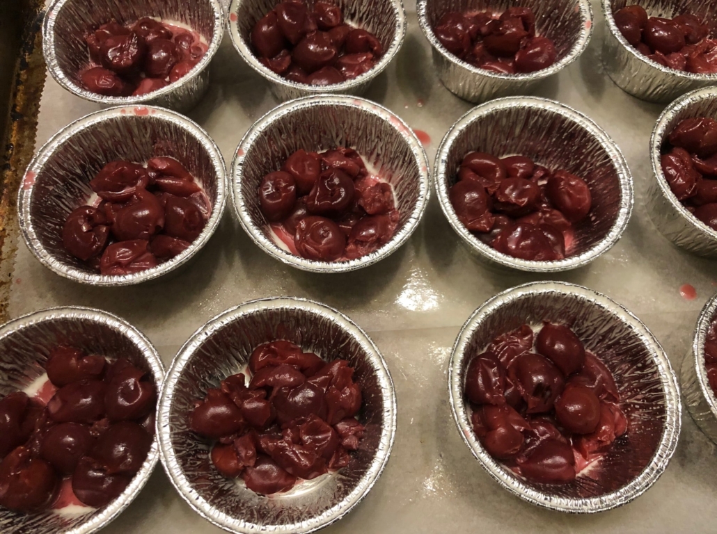 Cherries on the bottom of muffin cups