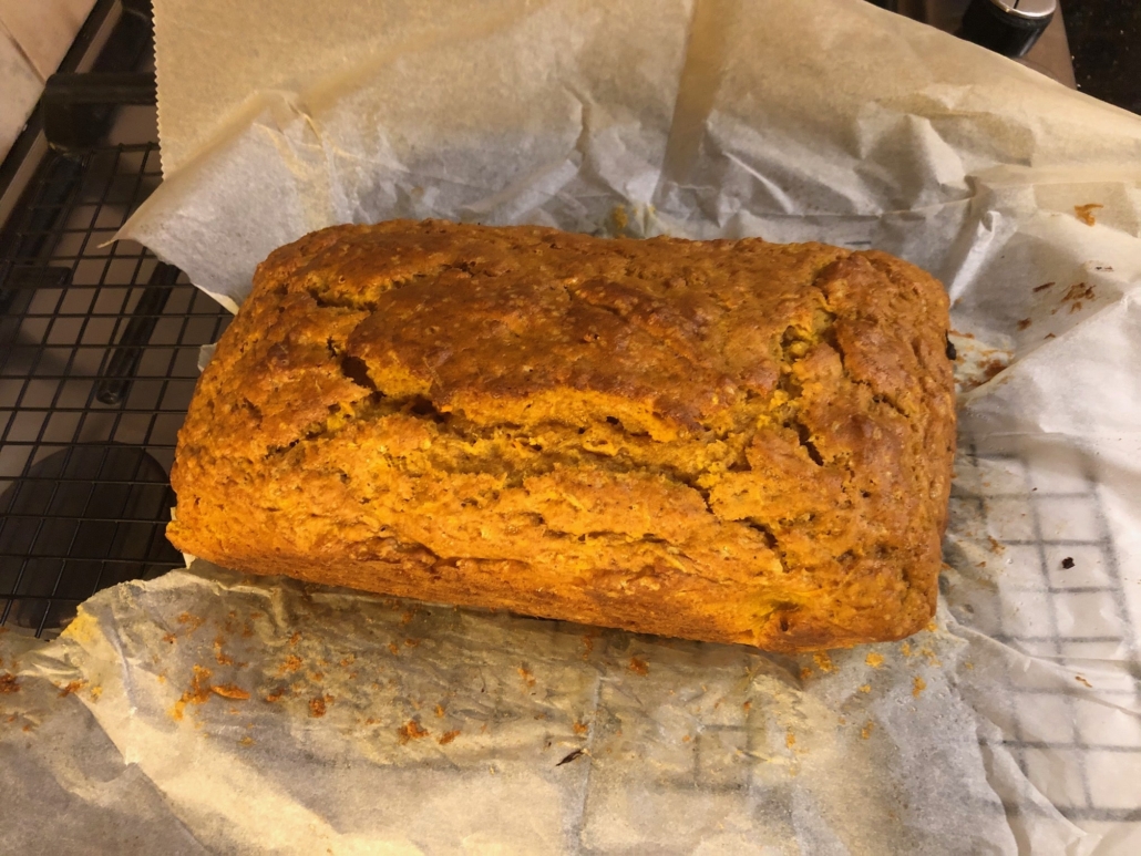 Harvest bread cooling on parchment paper on wire rack