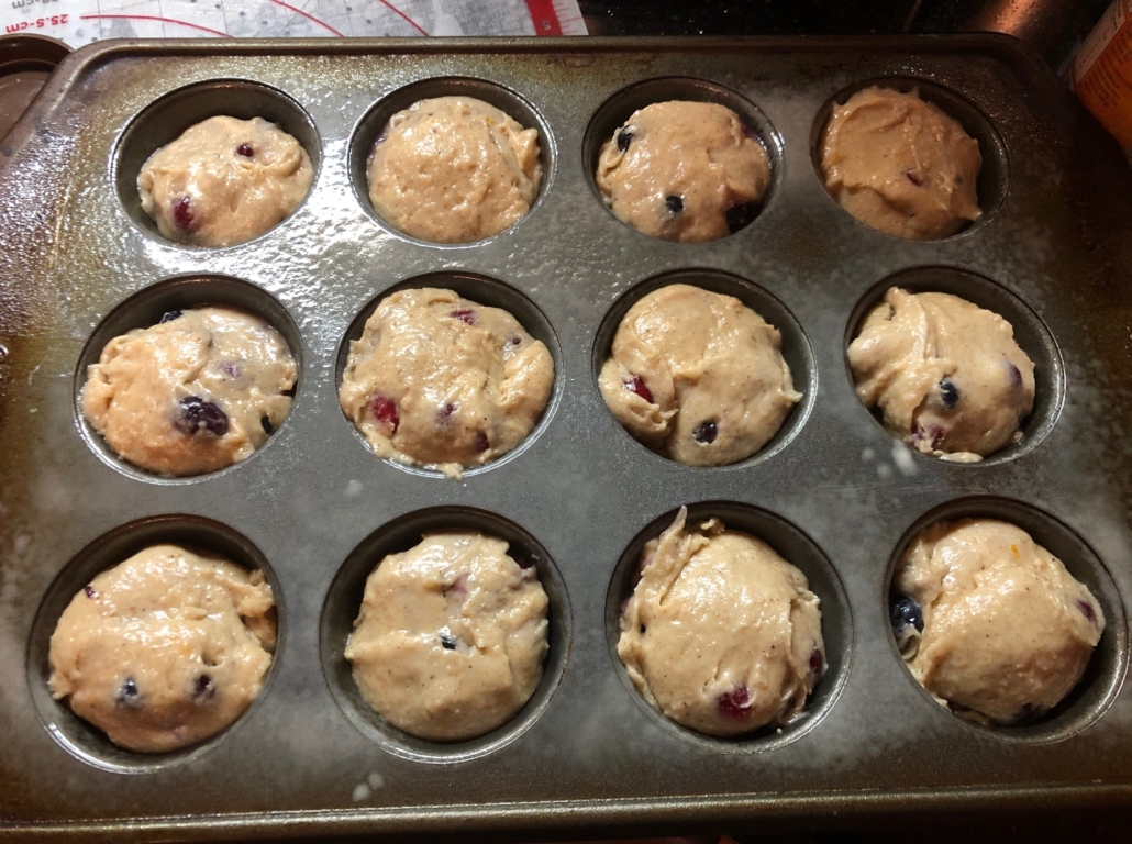 Batter scooped into muffin tin