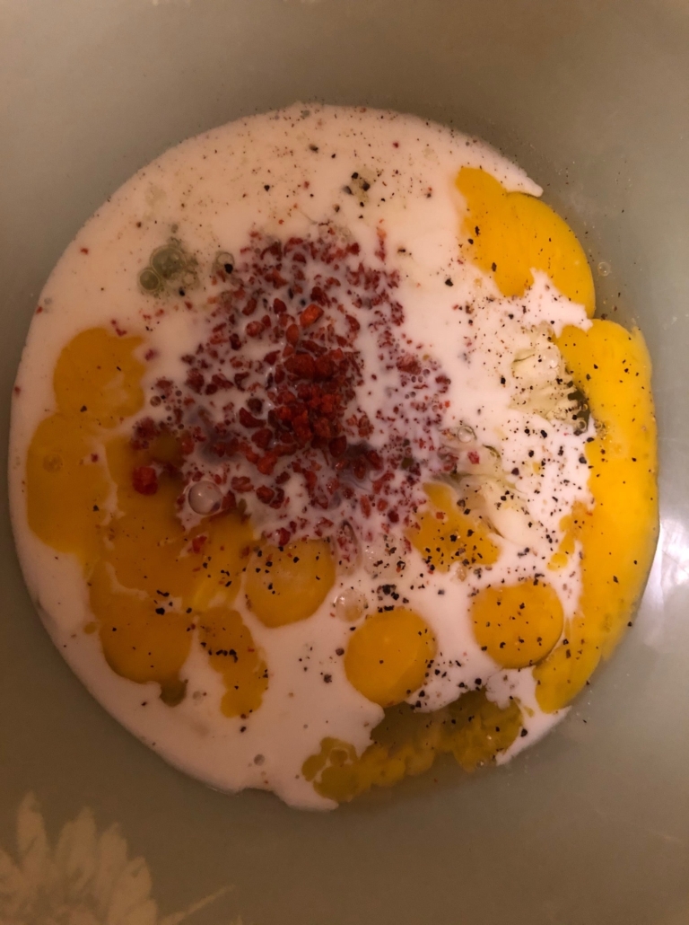 eggs, milk and Bacos with salt and pepper