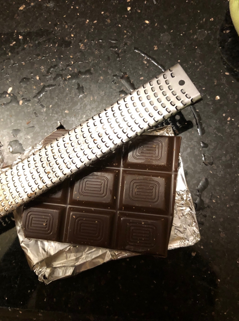 Grating the chocolate for the finish