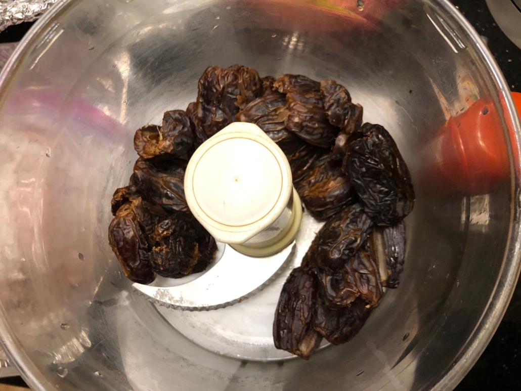 Halved dates in food processor