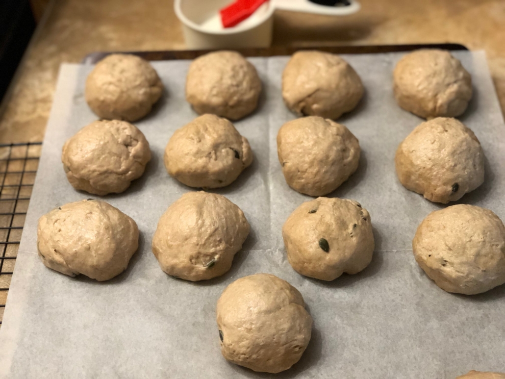 Rolls rising on baking sheet