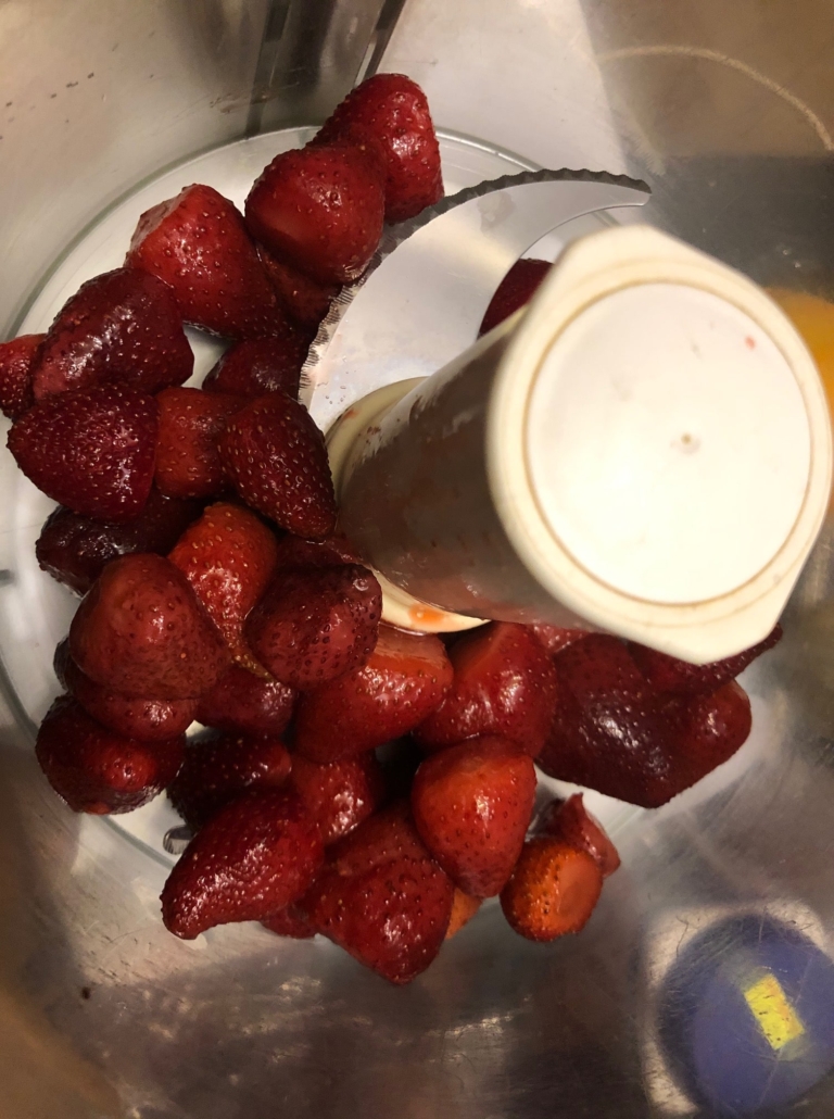 drained, defrosted strawberries in processor