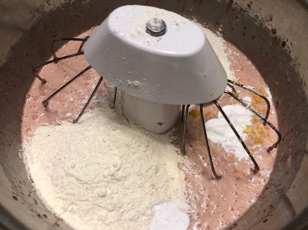 adding dry ingredients to batter
