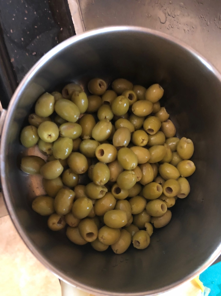 Drained, rinsed olives in pot