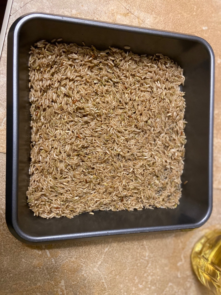 uncooked rice mixture evenly in pan