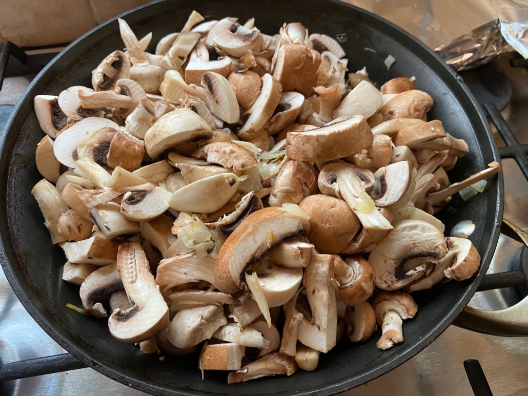 piling mushrooms on onions
