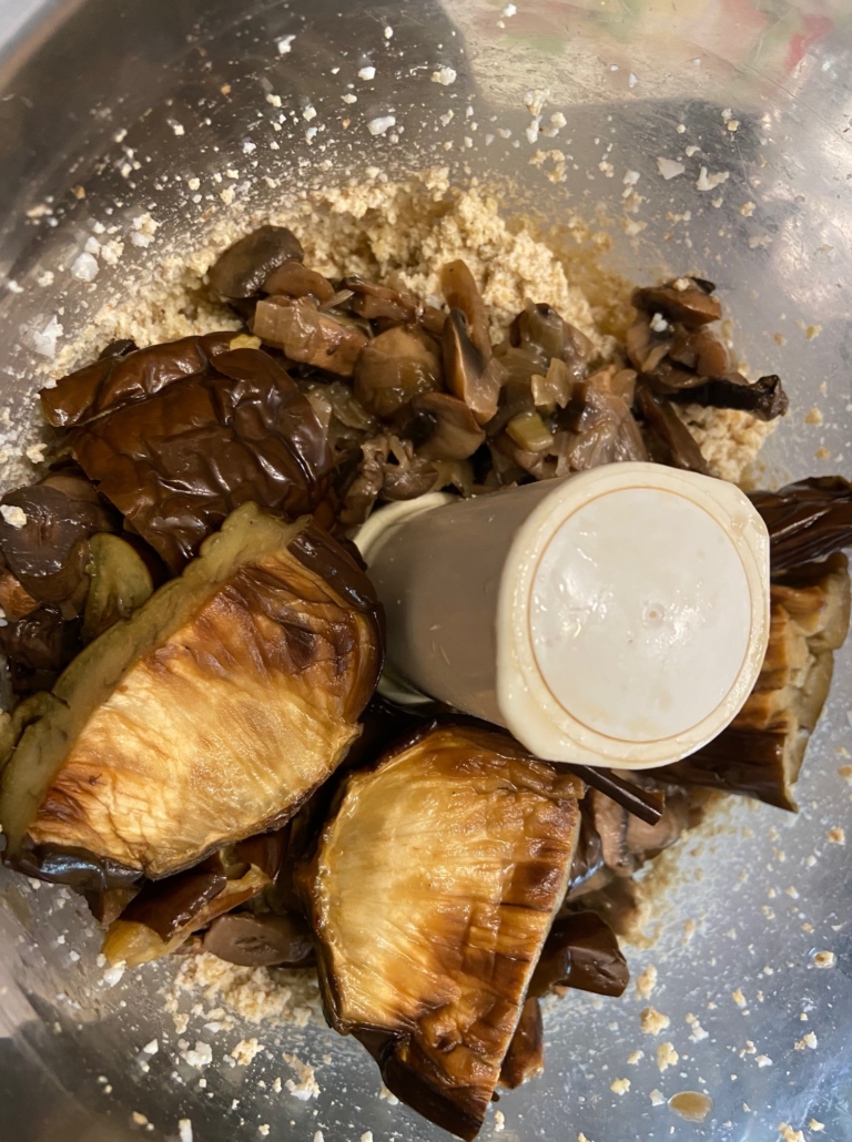 adding the mushrooms and onions and eggplant