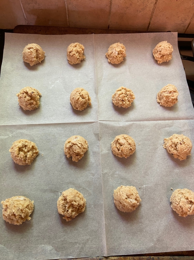 balls of dough on parchment lined pan