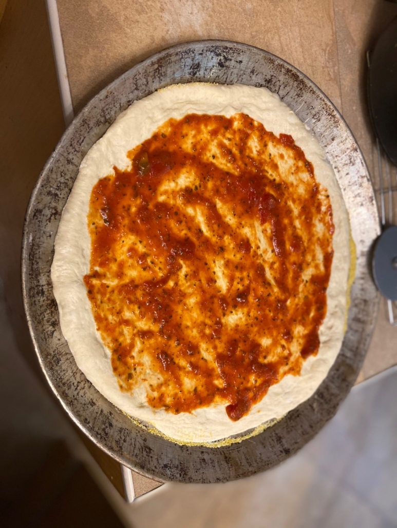 sauce spread on dough not edges