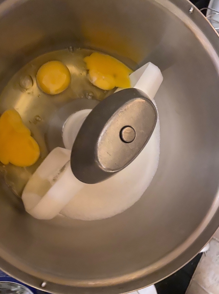 Beat eggs and sugar together