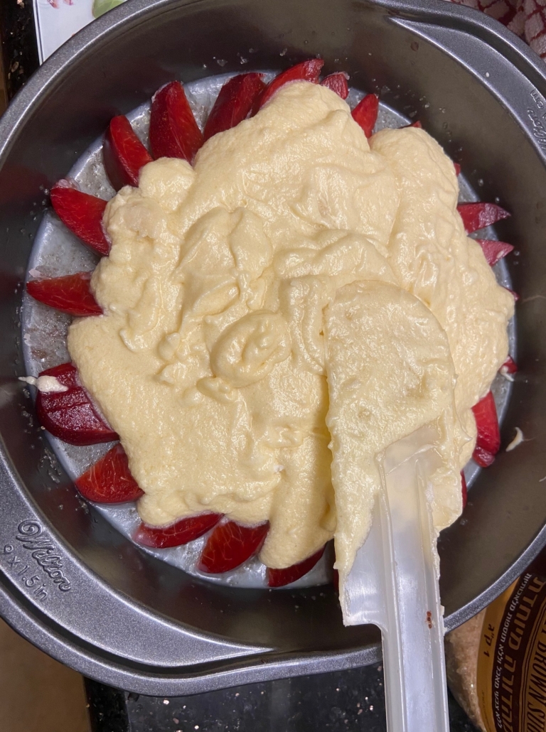 piling the batter on the plums