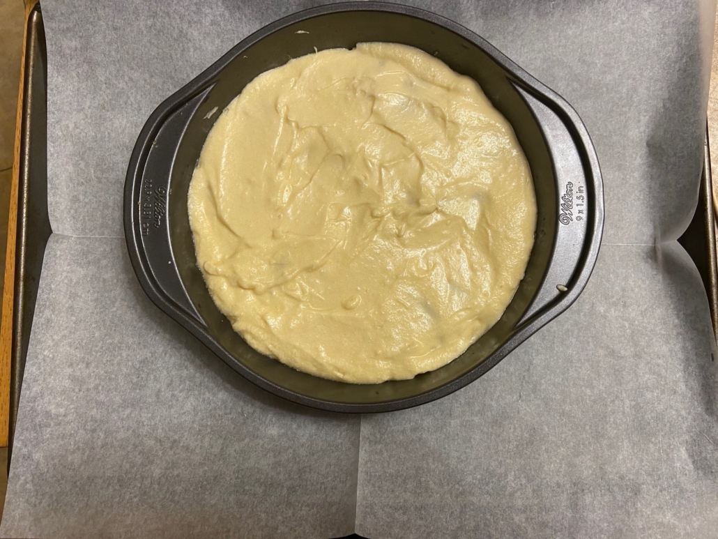 Smoothed batter over plums
