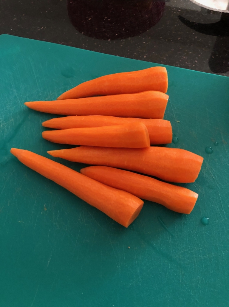 peeled carrots, with head and tail chopped off