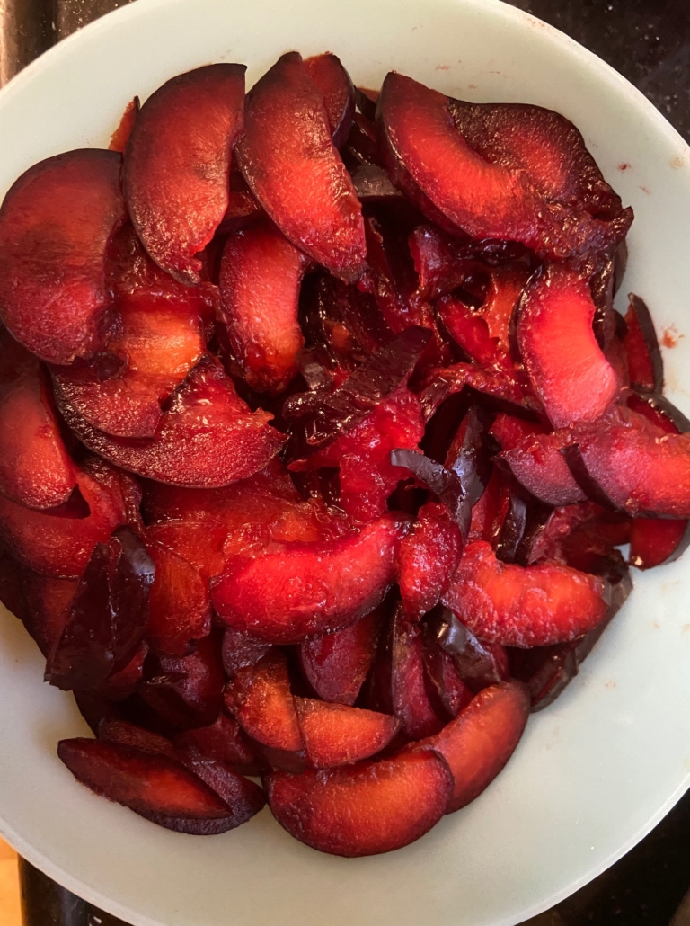 washed sliced slightly mushy plums