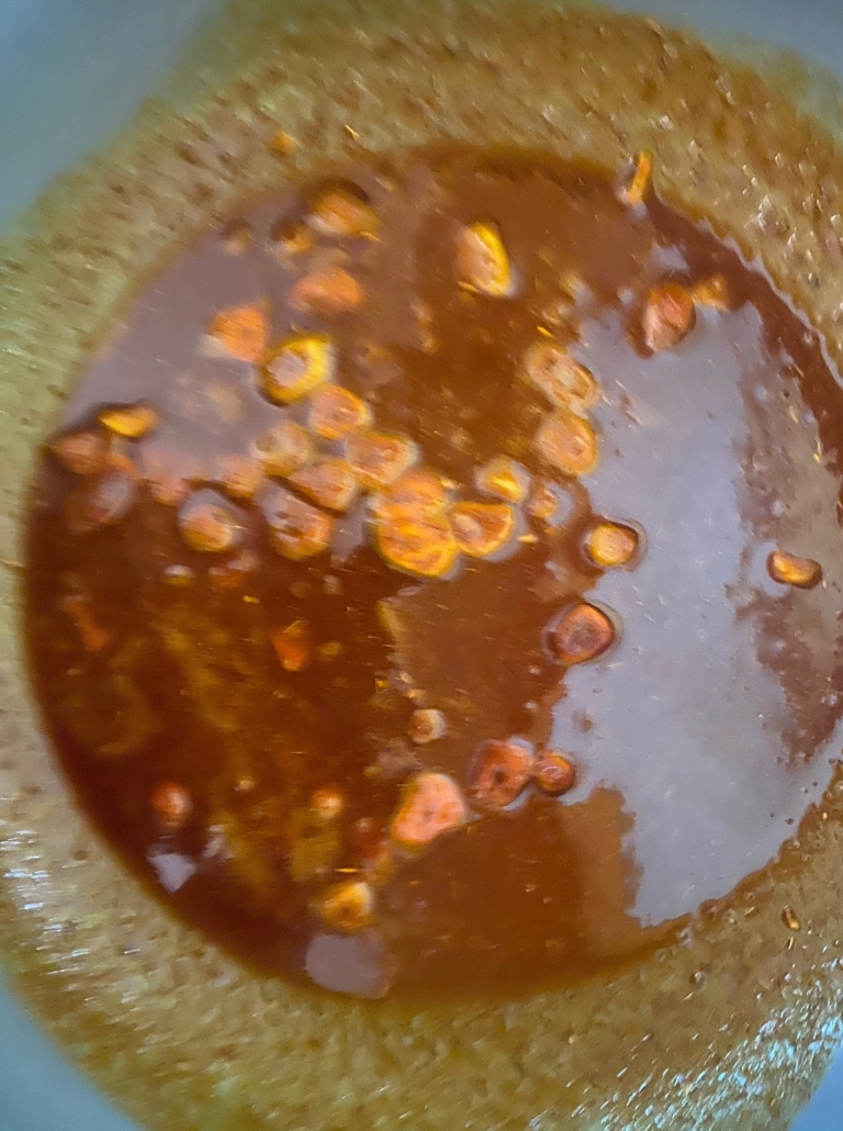 spices and garlic warming in olive oil