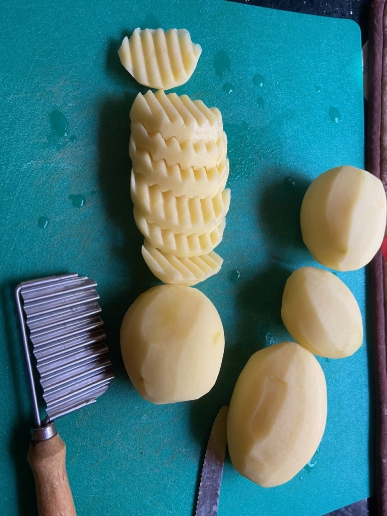 cutting potatoes with waffle cutter