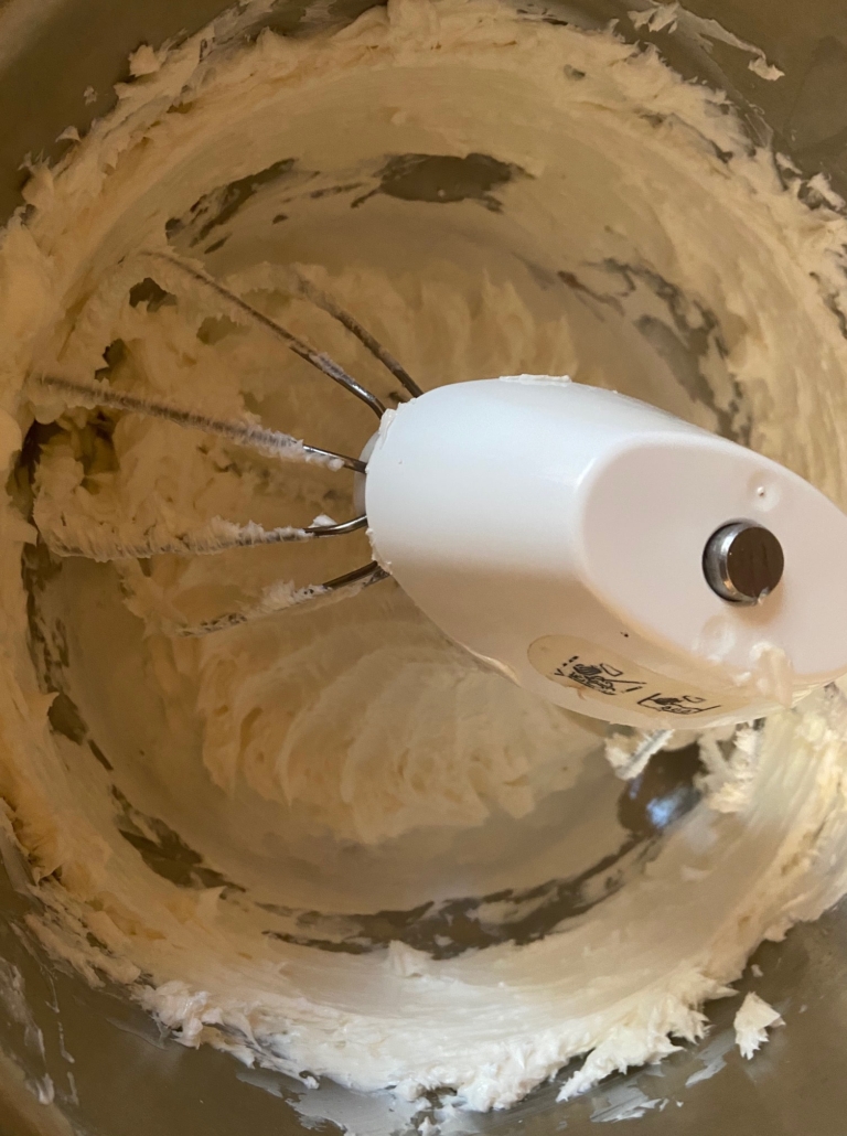 whisking the frosting