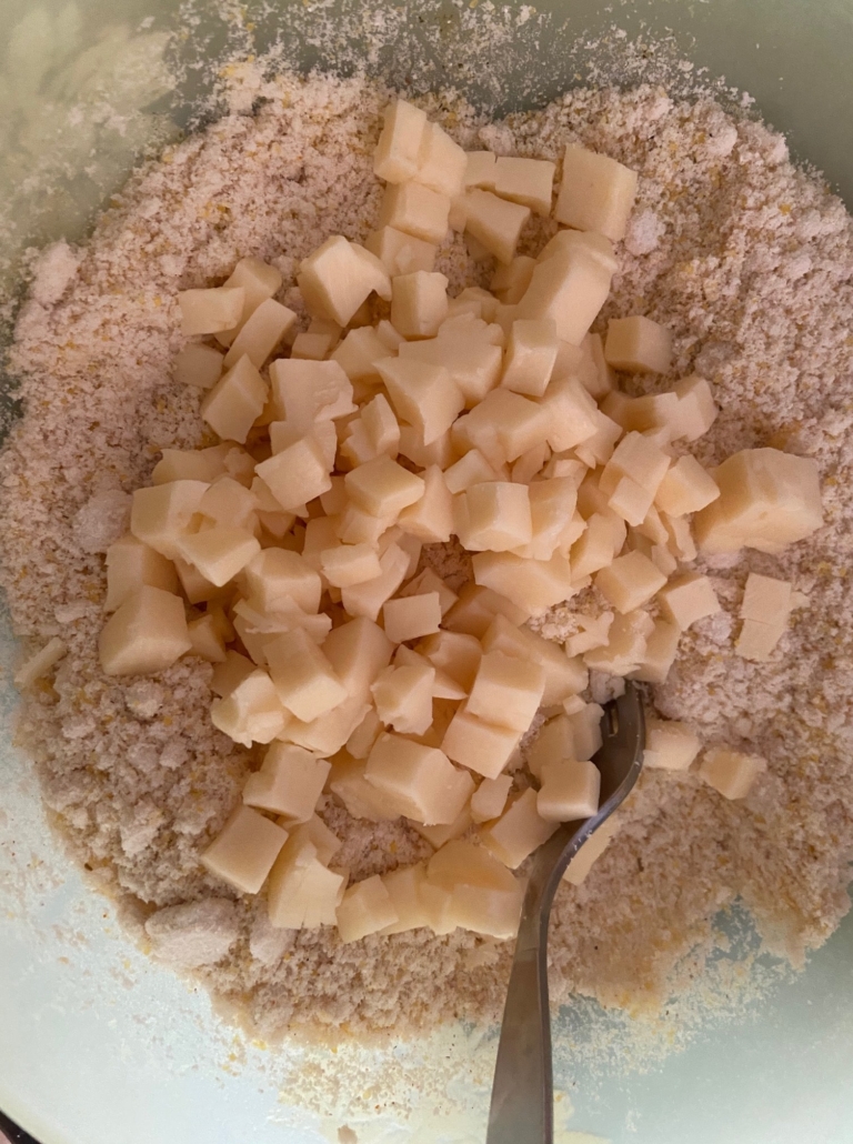 adding cheese to the mix