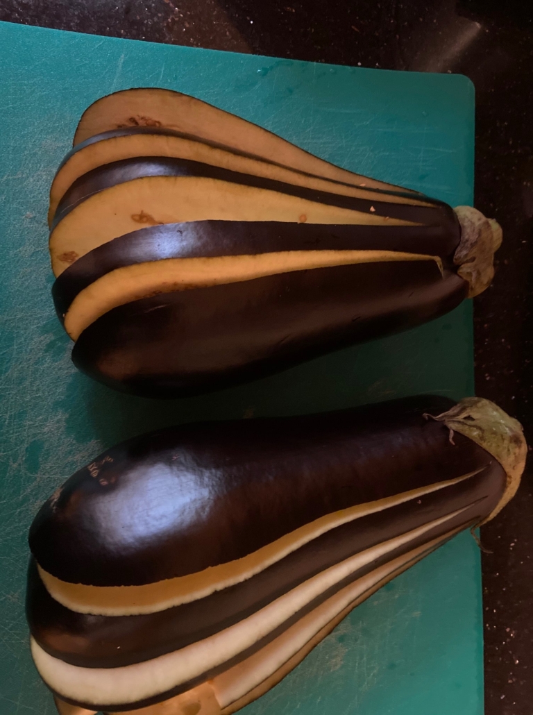 Leaving top on, slicing eggplant