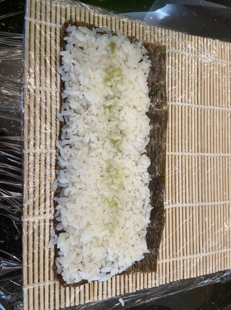 spread rice on nori with border at the end