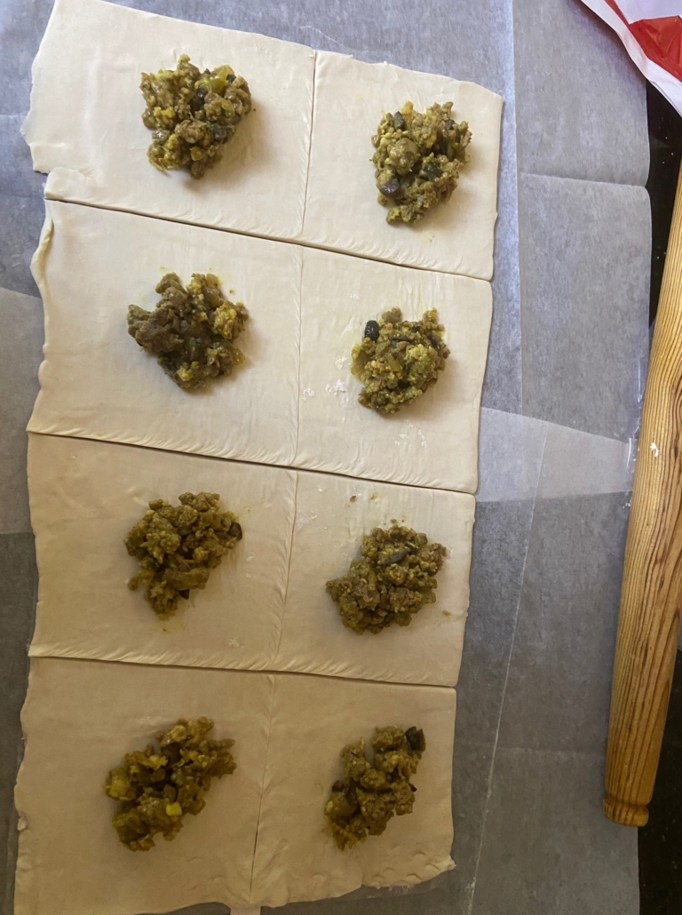 Puff pastry cut into squares with filling