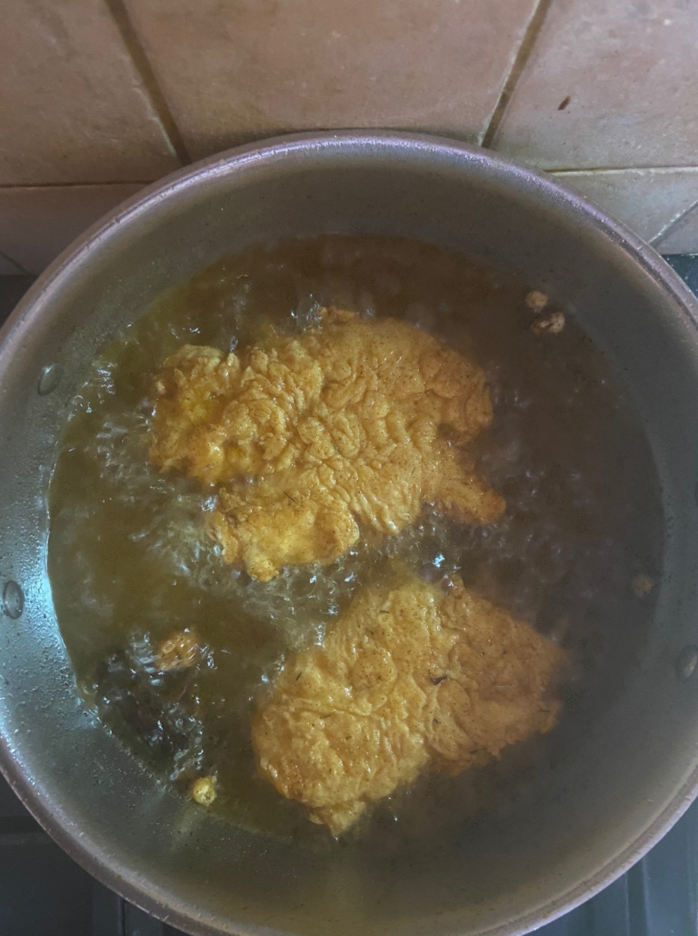 shnitzel frying in pan