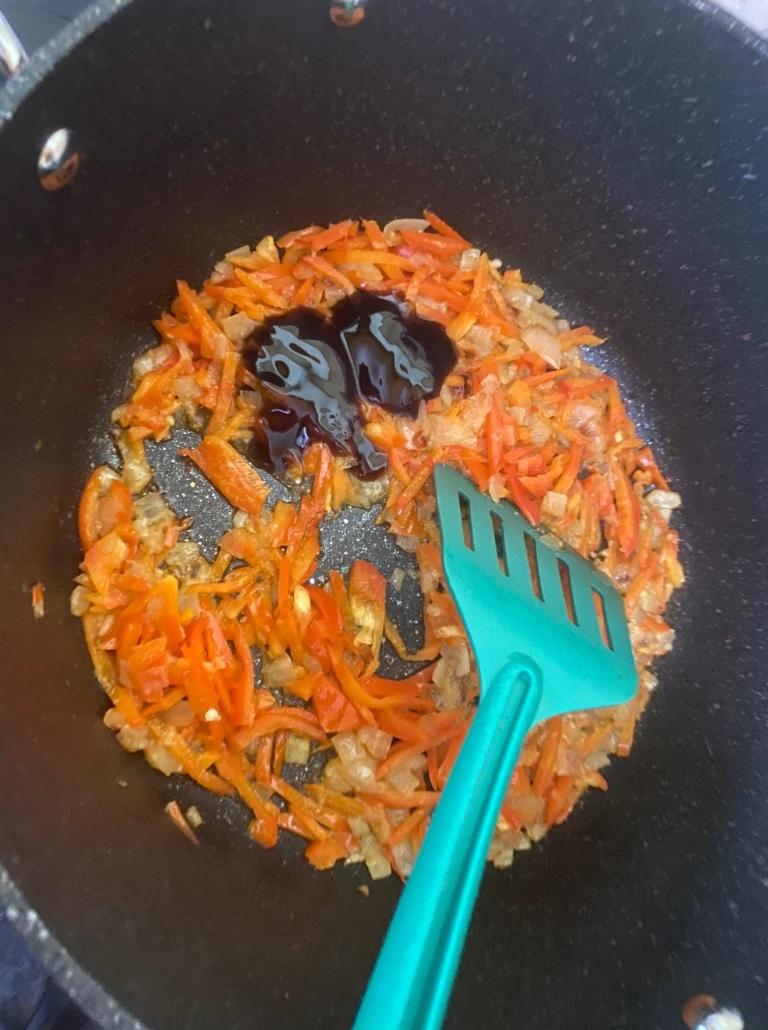 onion and pepper in pan