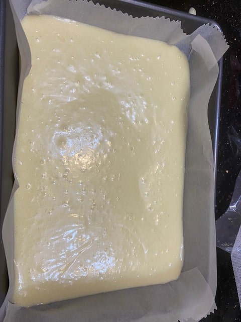 first layer of cake batter in pan