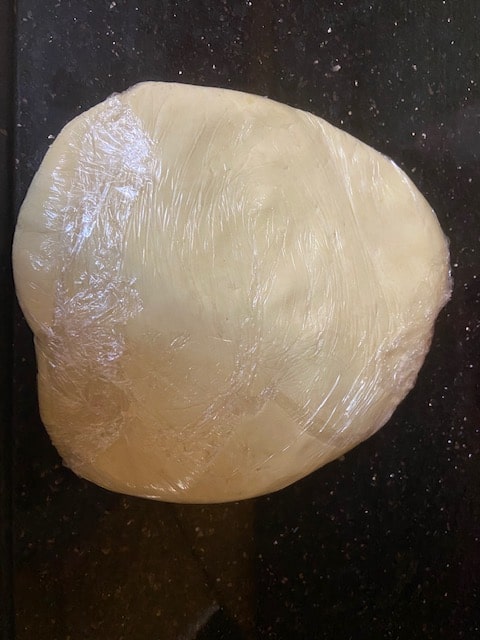 wrapped disk of dough