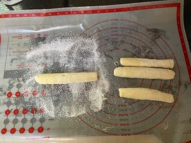 rolling dough into logs