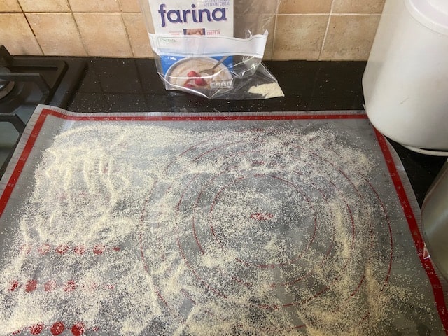 generously coat silpay with farina/cornmeal
