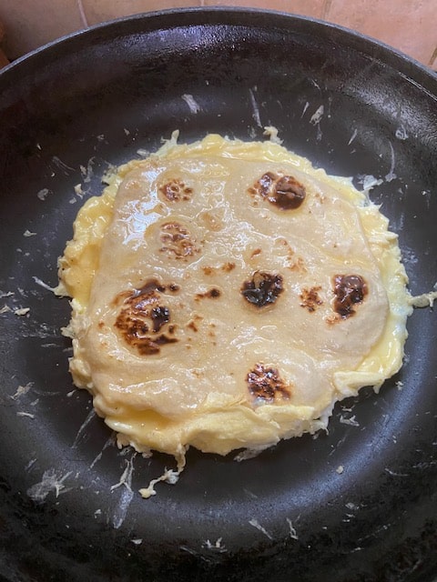 scraping egg to tortilla