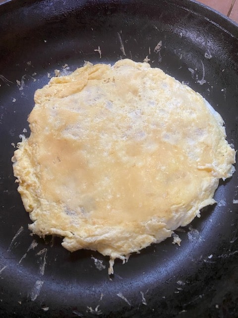 flip tortilla and egg together